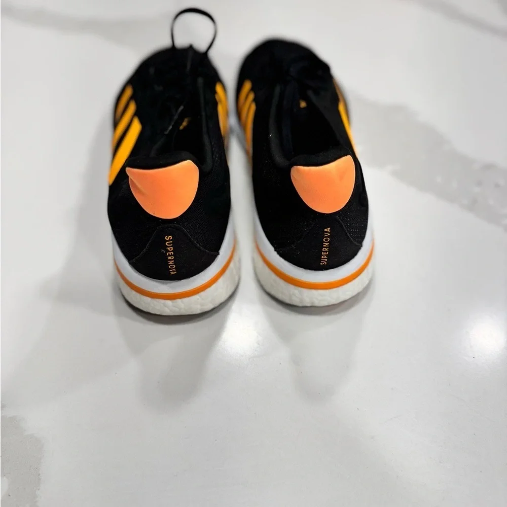 Adidas Supernova M 'Black Flash Orange' running shoe with model number GX2964.